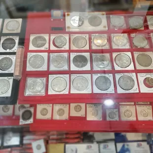 Morgan and Peace silver dollars.