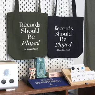 Our merchandise includes tote bags, pins, shirts, hats, stickers and more