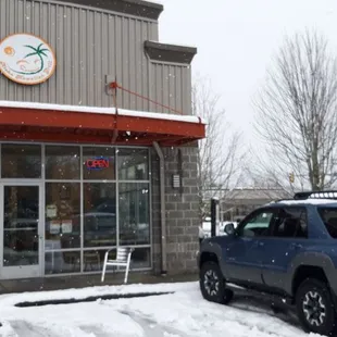 a car parked in front of a restaurant