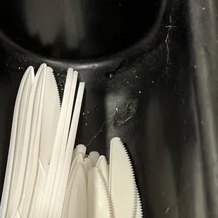 The &quot;clean&quot; silverware container, near the registered, filled with dust, lint, and crud.