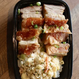 Crispy pork belly served with Mac salad and rice!