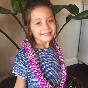 Sofi is in LOVE with her lei! :) Thanks Aloha Island Lei!