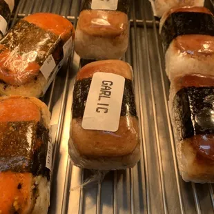 They have garlic spam musubi. Not bad but a lot of rice. Made by sushi chef.