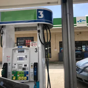 a gas pump and a car