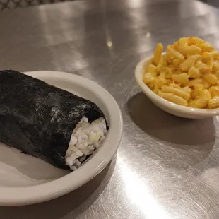 a sushi roll and macaroni and cheese