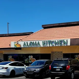 cars parked in front of a restaurant