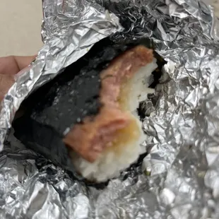 Spam Musubi with some type of white item embedded in the spam