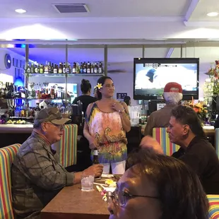 a group of people sitting at a table