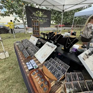 a woman looking at jewelry
