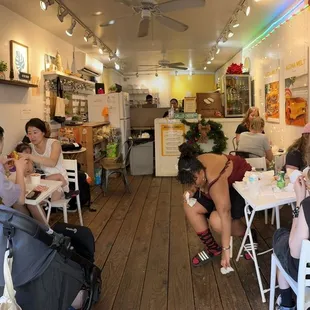 Inside seating. There&apos;s also 4 small tables right outside.