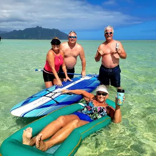 Happy customers relaxing on Kaneohe Bay at the  Sandbar