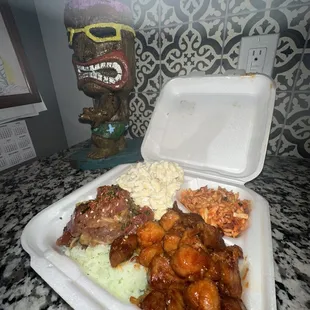 Build Your Own: Spicy Molokai Chicken with Yakisoba (front right) and Aloha rice with Tuna Poke.