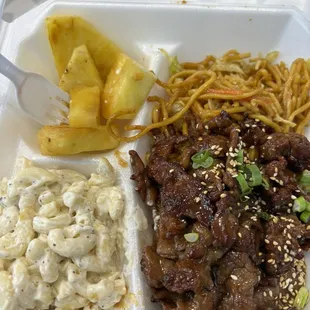 Grilled pineapple, beef Aloha Teri plate, macaroni, and yakisoba.