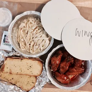 Fettuccini alfredo, garlic bread and sings $18.12