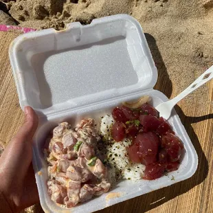 a person holding a container of food