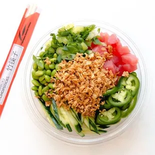 a bowl of food and chopsticks