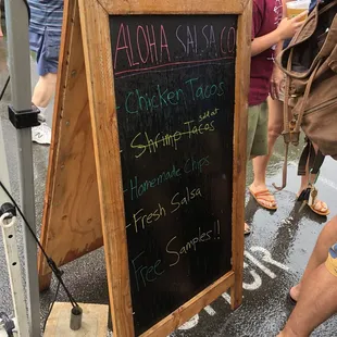 a chalkboard with a chalkboard saying aloha salsa