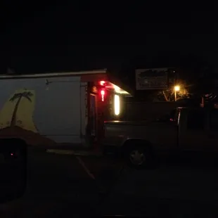 a palm tree painted on the side of a truck