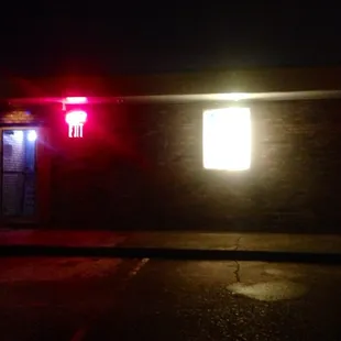 a red traffic light at night