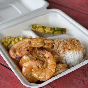 shrimp and rice in a styrofoam container