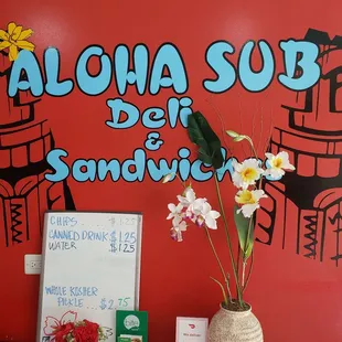 a sign and flowers