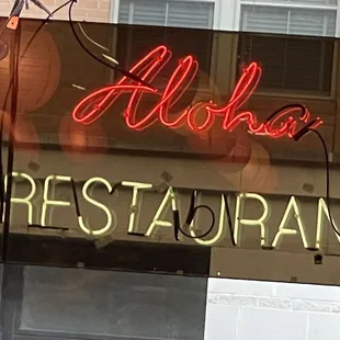 a neon sign for a restaurant