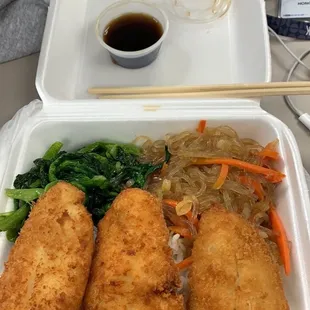 a meal in a styrofoam container