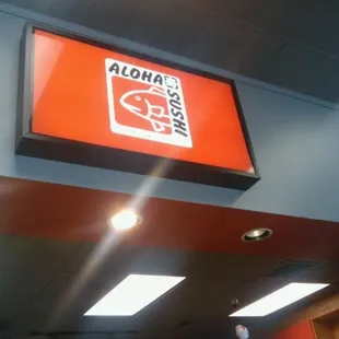 an aloha sushi restaurant sign