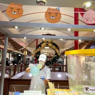 a man in a white hat and apron