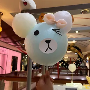 a hand holding a balloon