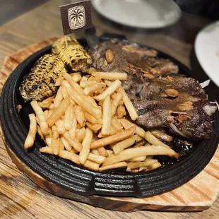 Hawaiian Ginger Rib-eye steak with French fries and corn