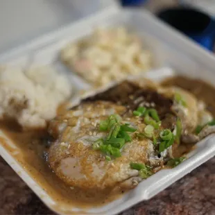 a meal in a styrofoam container