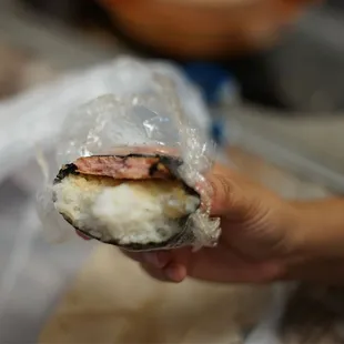 a sandwich wrapped in plastic