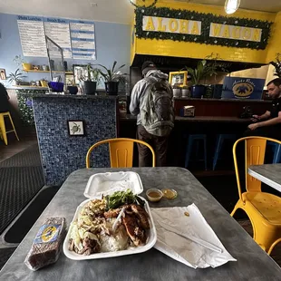 Dining area and mixed plate (bbq chicken and pig)