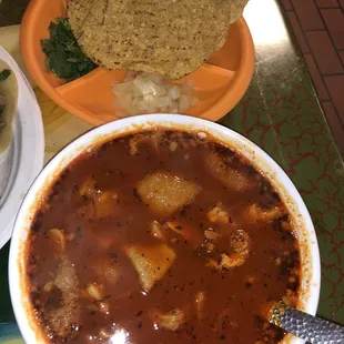 a bowl of chili and tortilla