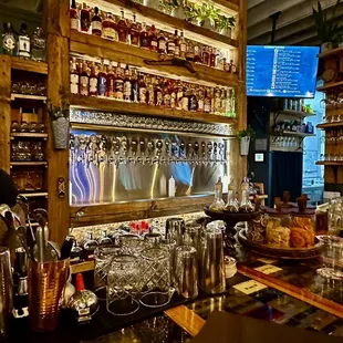 a bar with a variety of drinks
