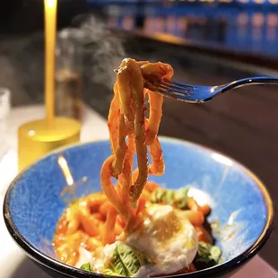 Pici: Hand-rolled Thick Noodle w/ burrata, tomato butter sauce, new harvest olive oil, basil ($25)
