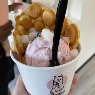 Bubble waffle with strawberry ice cream mochi and sprinkles