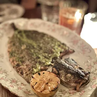 a plate of fish and vegetables