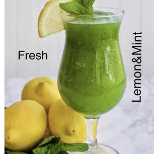 a green smoothie with lemons and mint