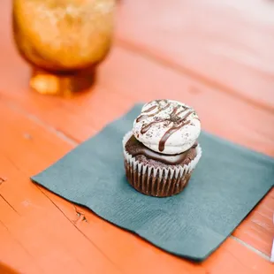 a cupcake on a napkin