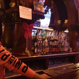 a woman standing at the bar