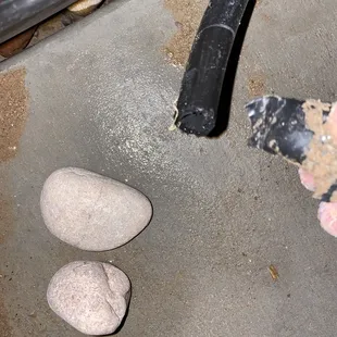 a person&apos;s feet and a rock