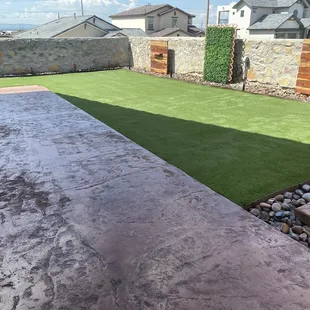 a backyard with artificial grass