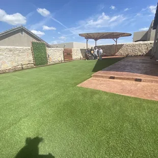a backyard with artificial grass