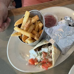 Gyro sandwich with fries