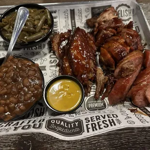 Sausage, bbq chicken and brisket with green beans and baked beans! All yums