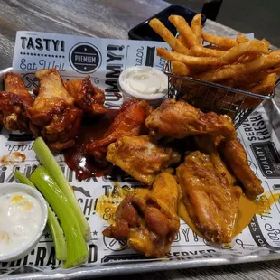 Chicken wings with two types of sauce. Side of fries