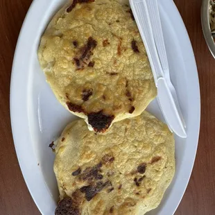 Pupusas, one asada, one chicken
