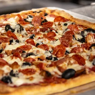 a pepperoni and black olive pizza